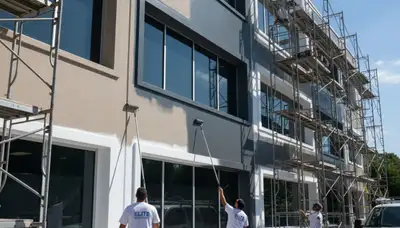 Professional commercial painters applying durable coatings to business exterior in Easton, PA
