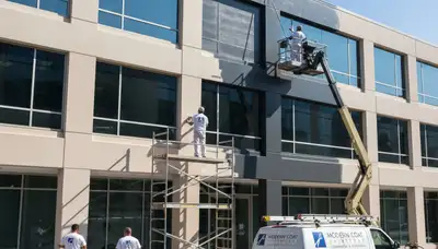 Professional commercial painters in Easton, PA applying fresh paint to local business exterior