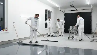 Professional epoxy floor coating application in Easton, PA garage by local painting experts