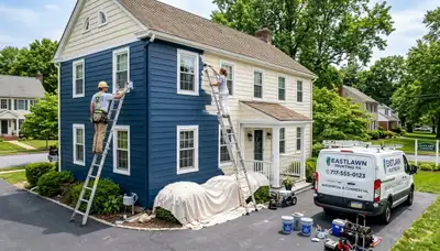 Professional house painters working on residential exterior in Easton, PA