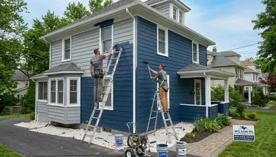 Professional house painters working on residential exterior in Easton, PA